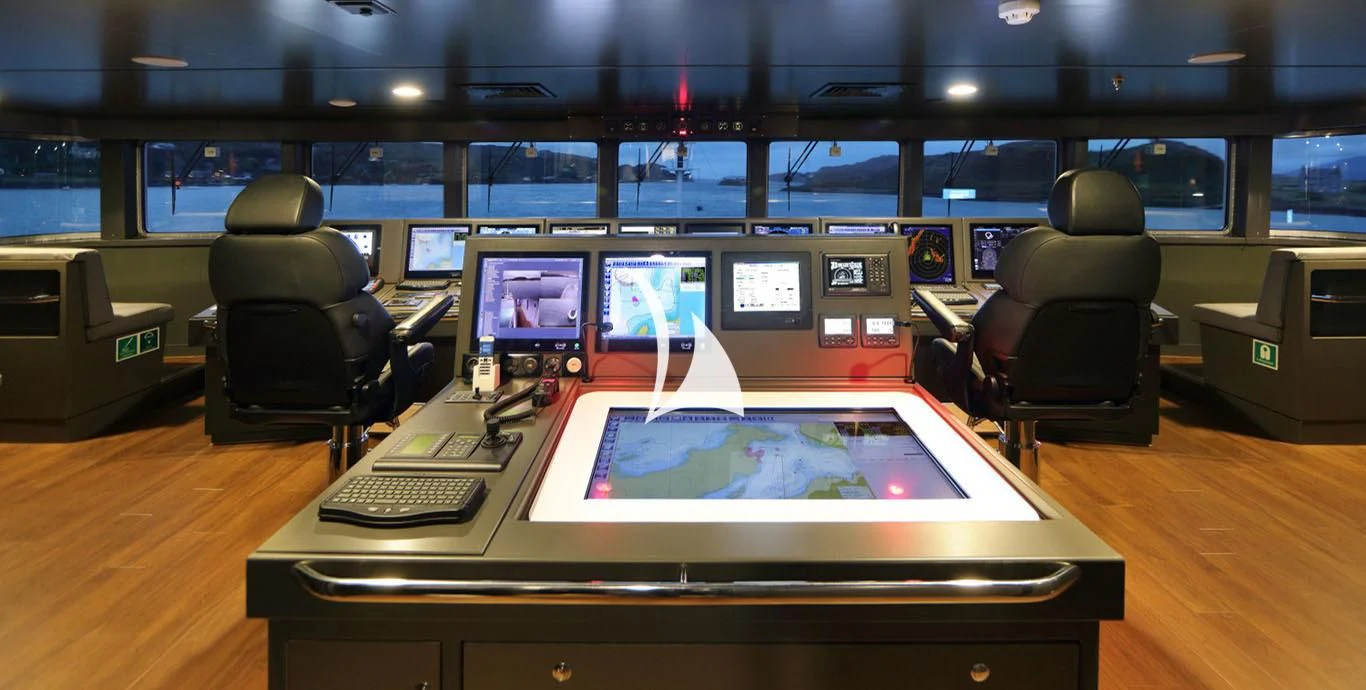 a room with a table and chairs aboard YERSIN Yacht for Charter