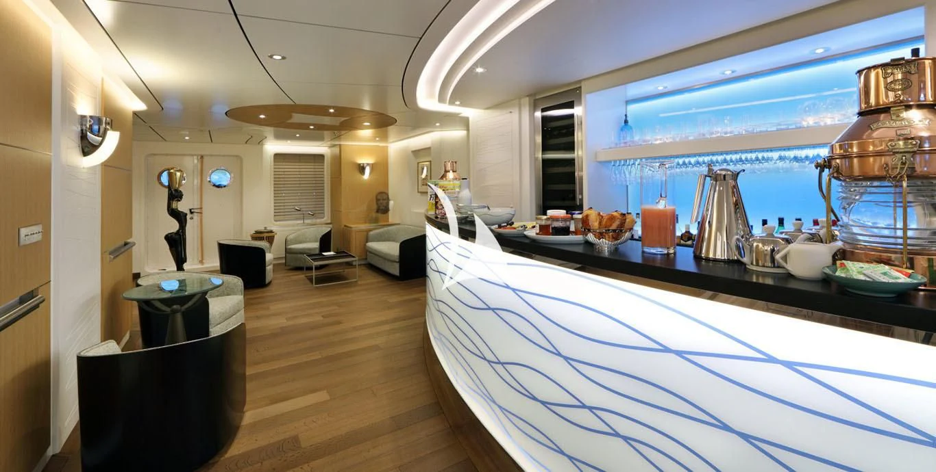 a large room with a pool table and chairs aboard YERSIN Yacht for Charter