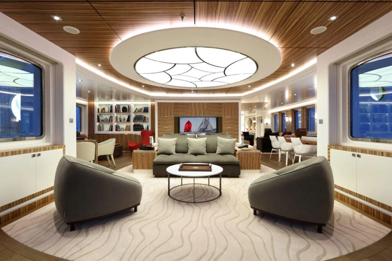 a large living room with a large chandelier aboard YERSIN Yacht for Charter