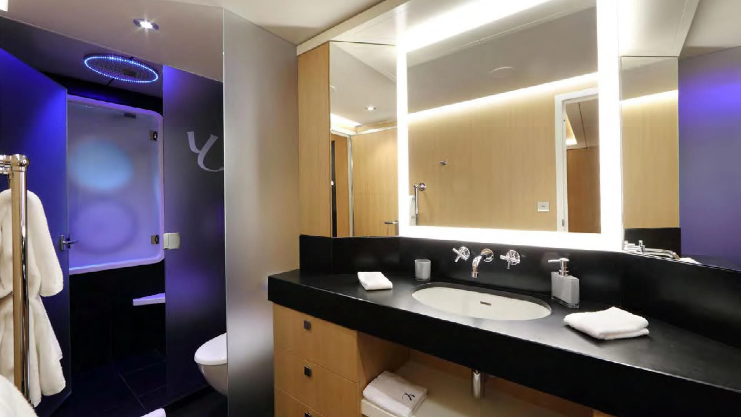 a bathroom with a sink and mirror aboard YERSIN Yacht for Charter
