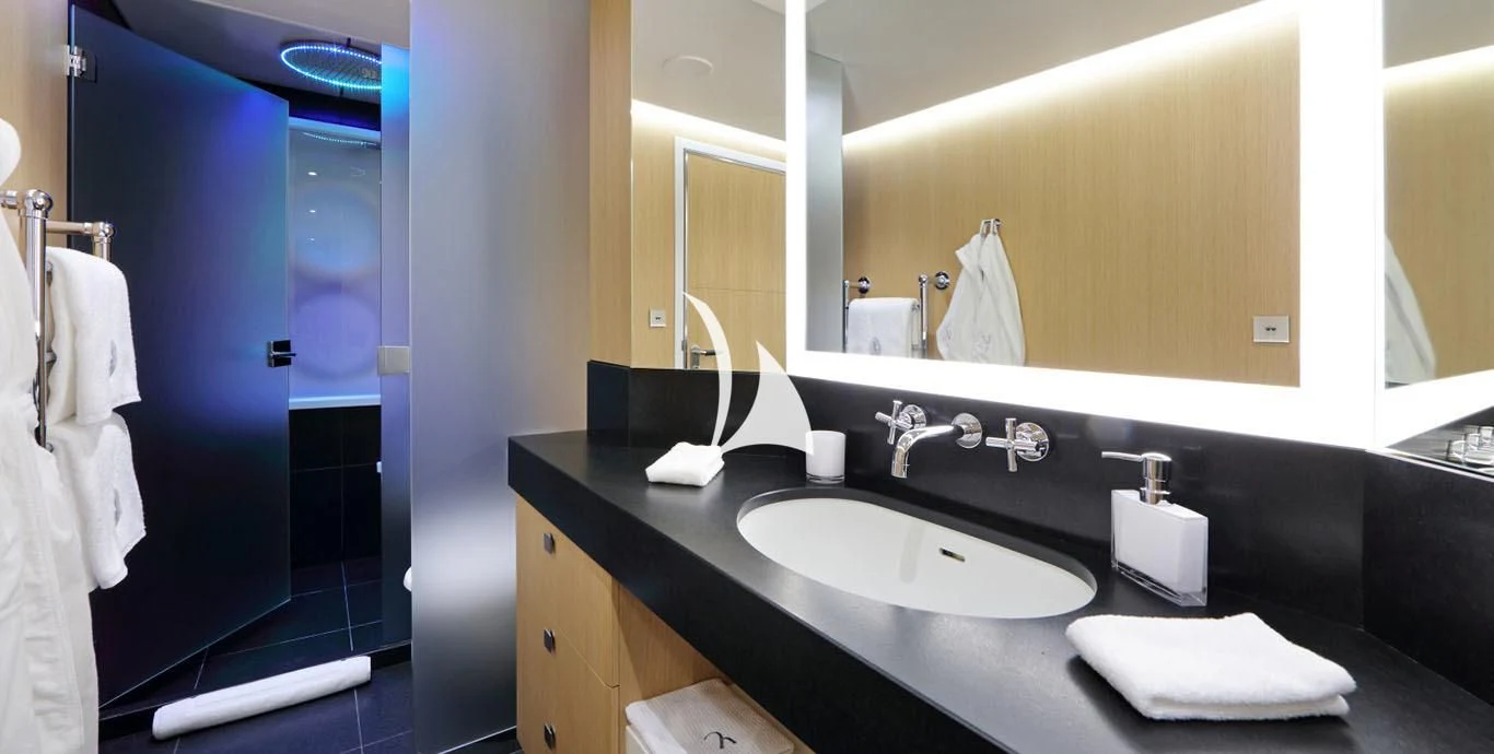 a bathroom with a sink and mirror aboard YERSIN Yacht for Charter