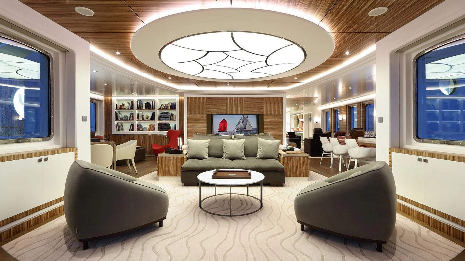 a living room with a large chandelier aboard YERSIN Yacht for Charter