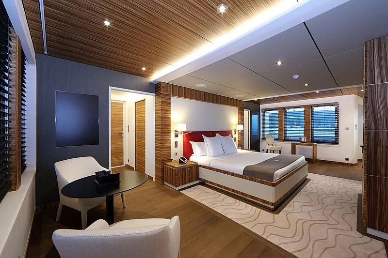 a large bedroom with a large bed aboard YERSIN Yacht for Charter