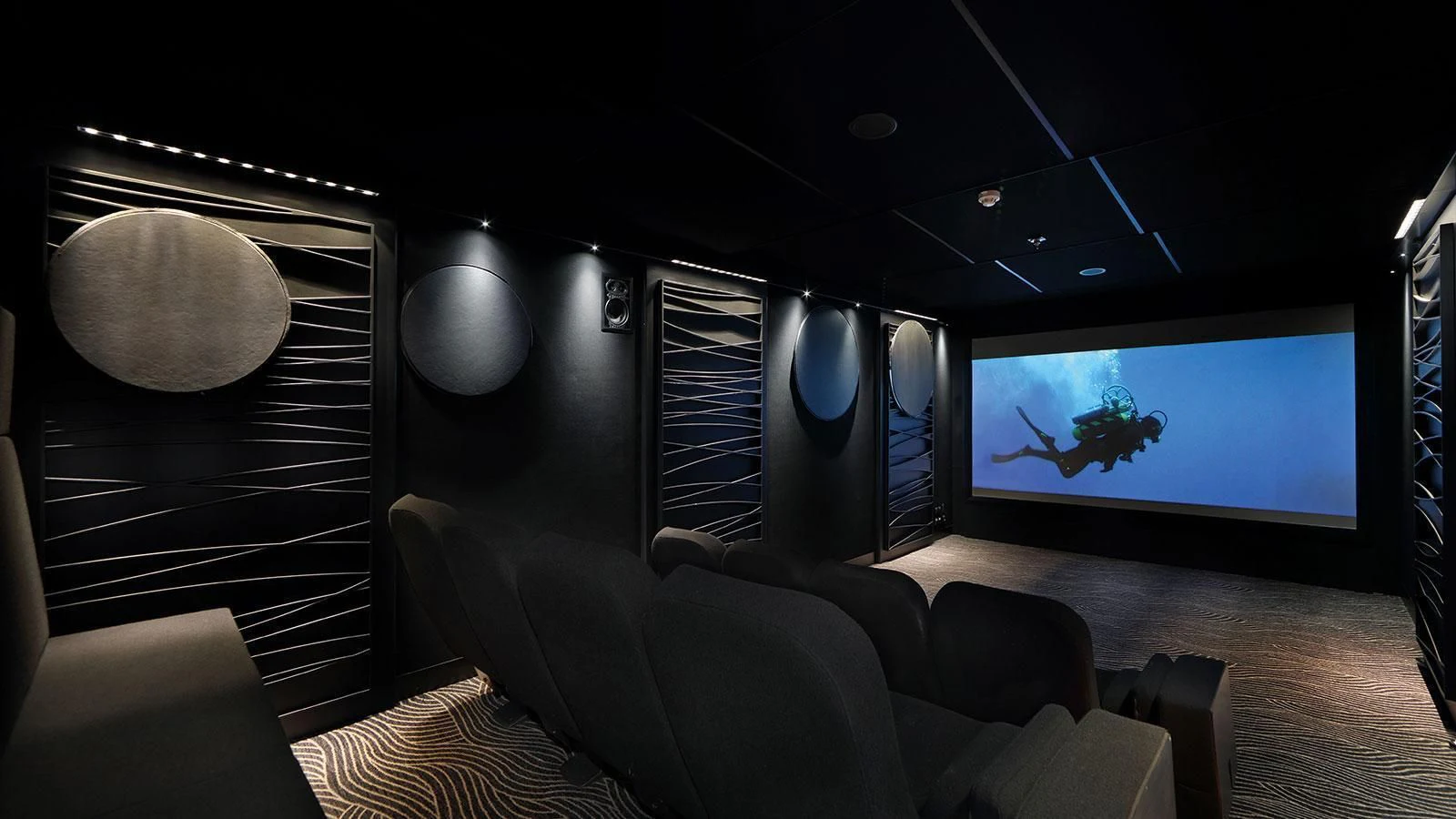 a room with a large television and a couch aboard YERSIN Yacht for Charter