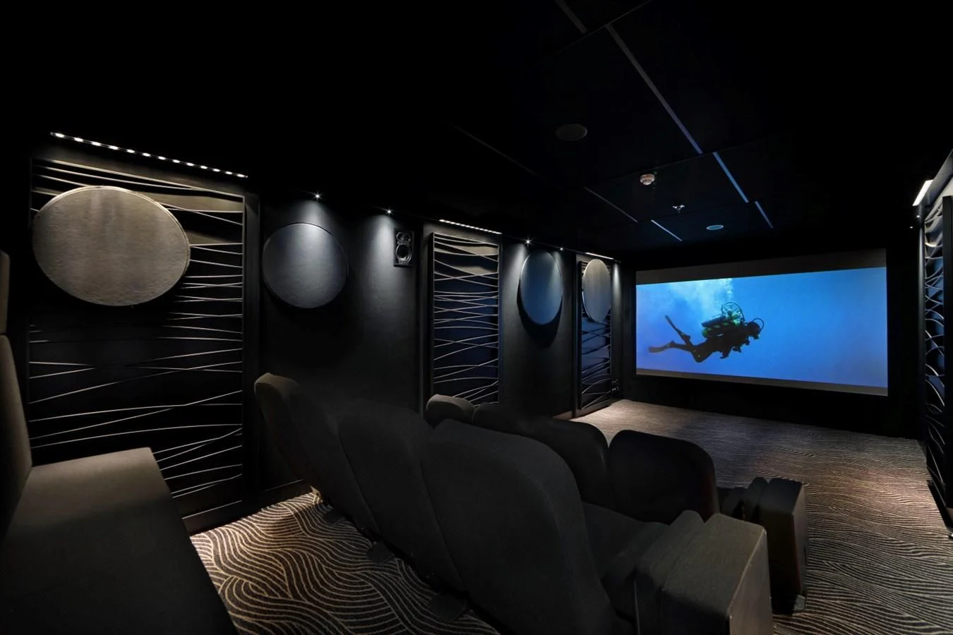 a room with a tv and couches aboard YERSIN Yacht for Charter