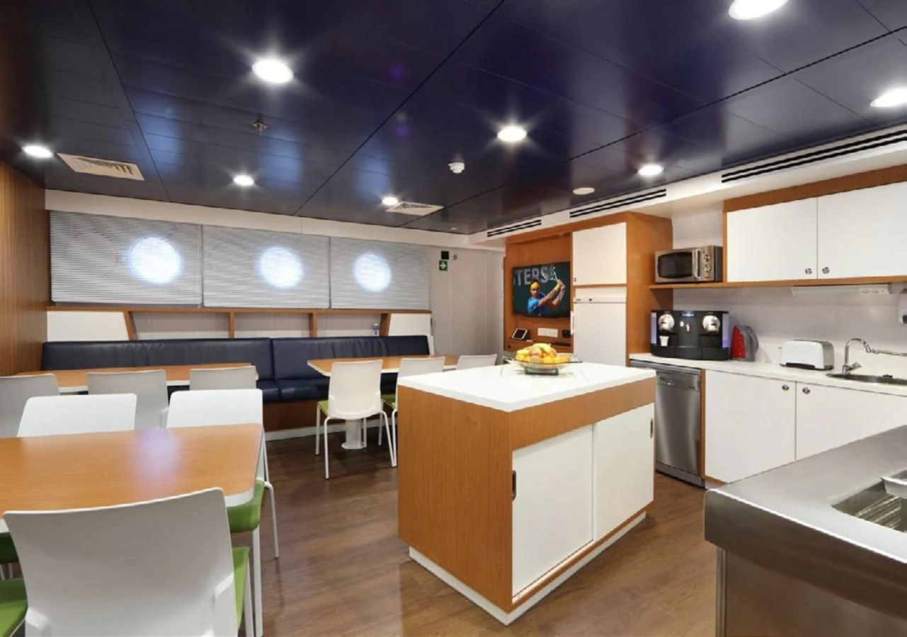 a kitchen with white cabinets aboard YERSIN Yacht for Charter