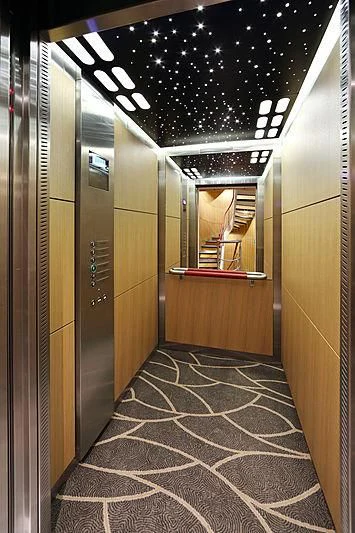 a hallway with a glass door aboard YERSIN Yacht for Charter