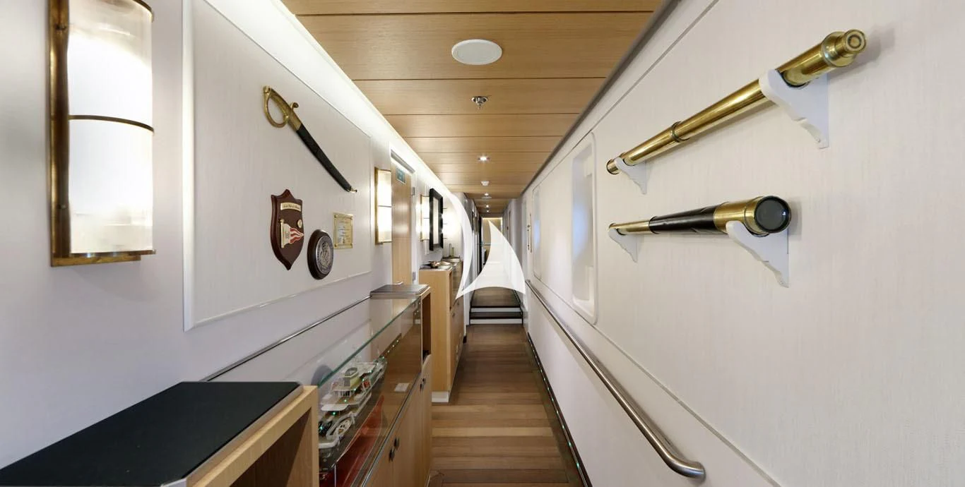 a white wall with a door and a mirror on it aboard YERSIN Yacht for Charter
