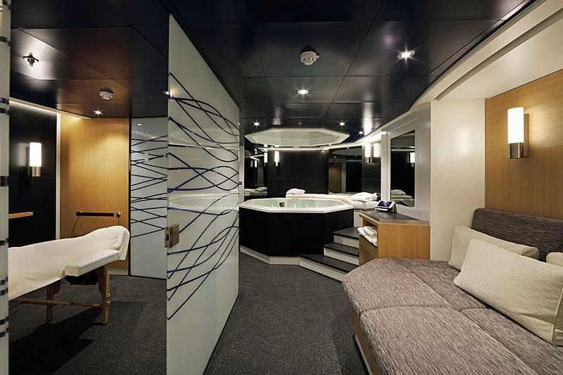 a room with a bed and a desk aboard YERSIN Yacht for Charter
