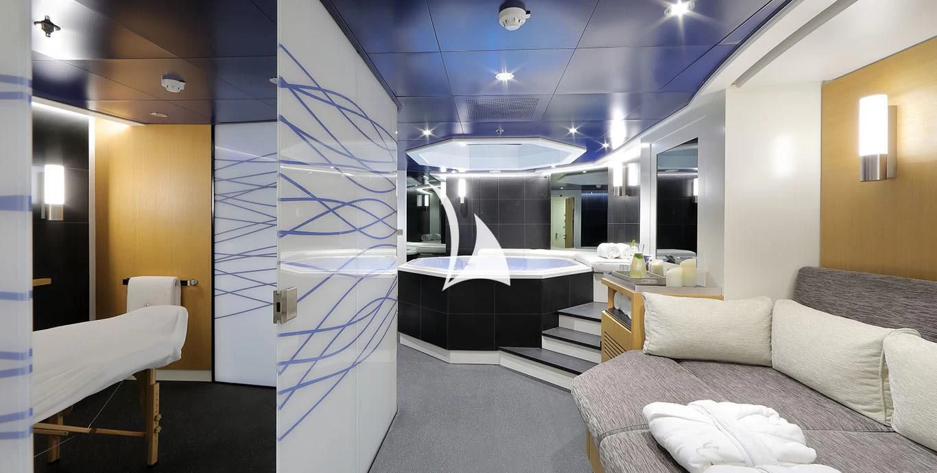 a room with a bed and a large mirror aboard YERSIN Yacht for Charter