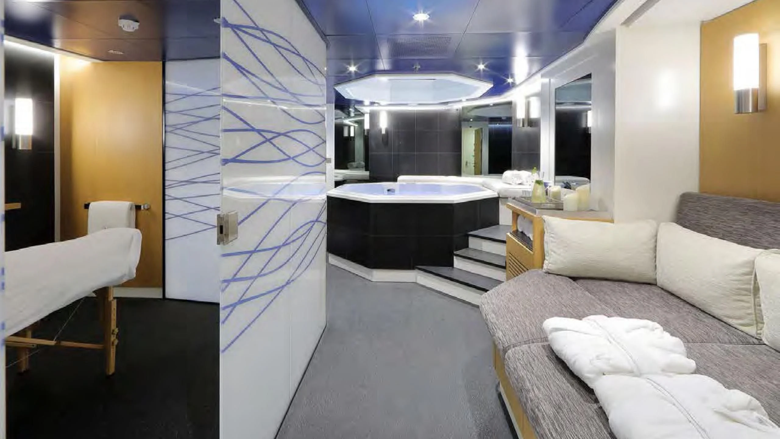 a room with a bed and a table aboard YERSIN Yacht for Charter