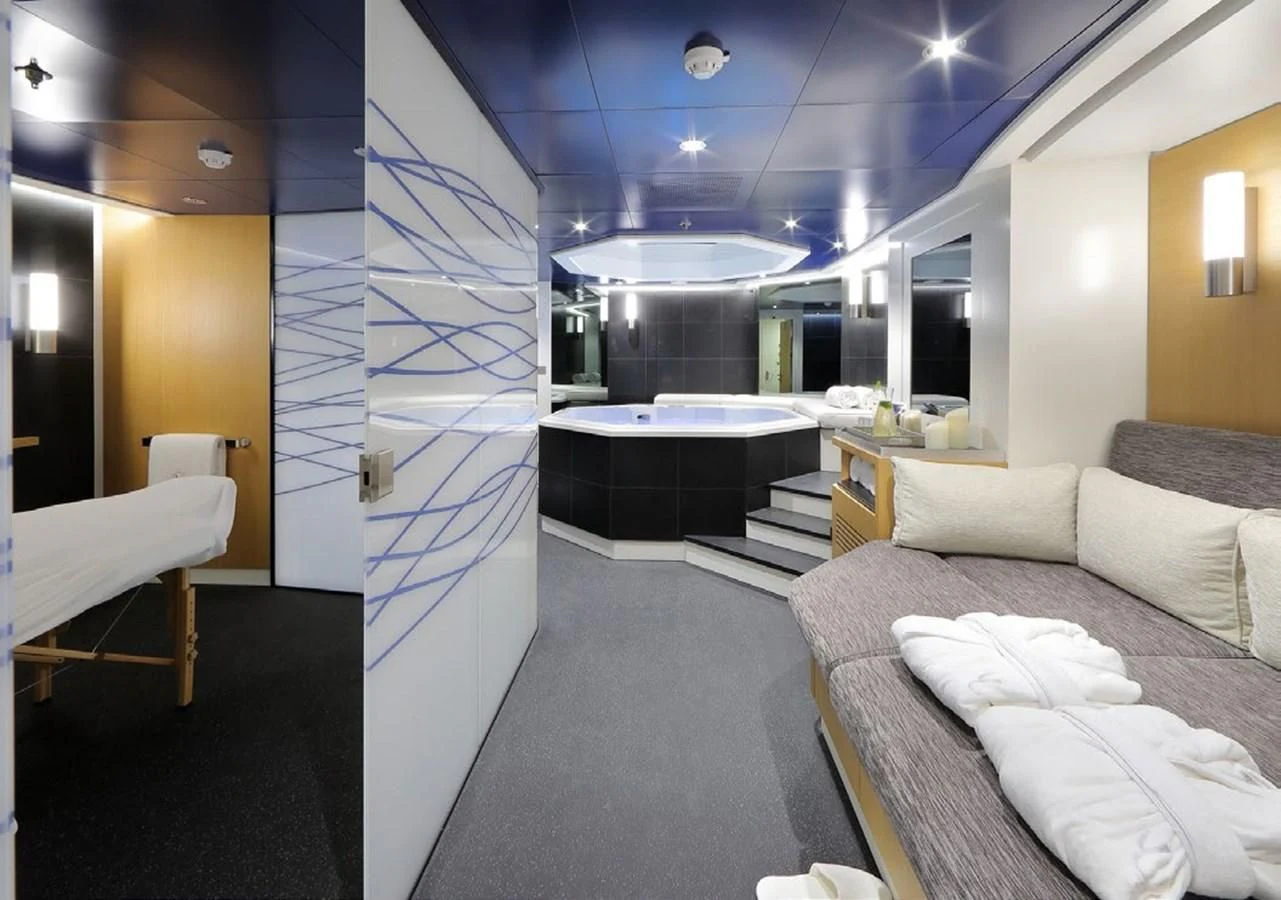 a room with a bed and a large glass wall aboard YERSIN Yacht for Charter