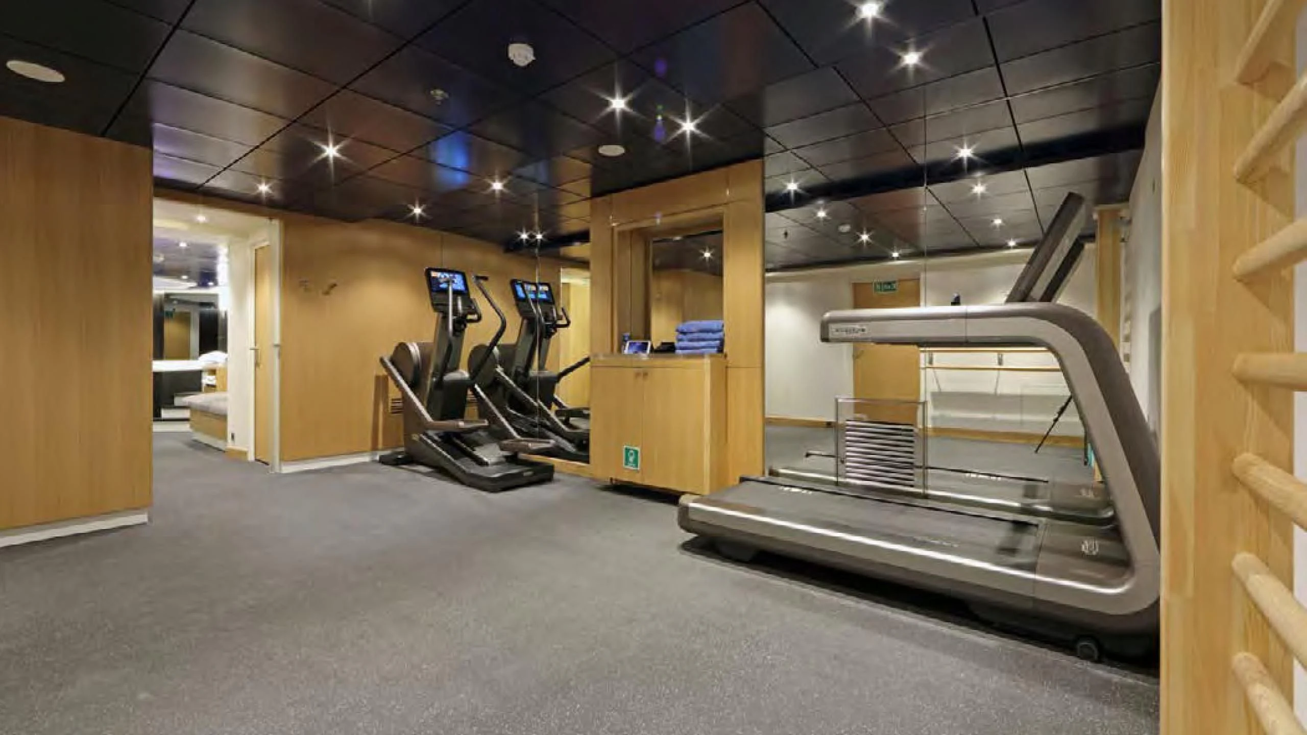 a gym with equipment aboard YERSIN Yacht for Charter