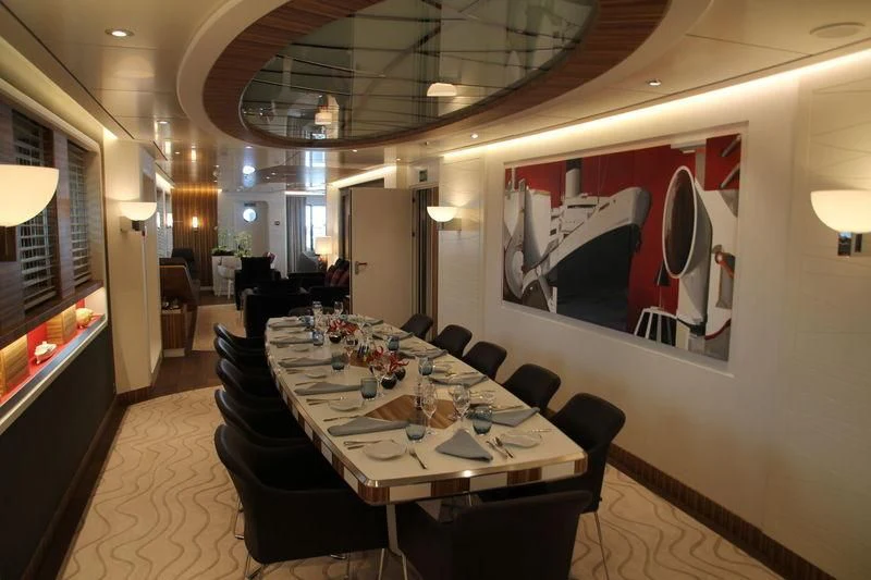 a conference room with a table and chairs aboard YERSIN Yacht for Charter