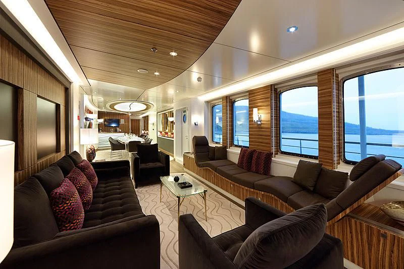 a living room with a large window aboard YERSIN Yacht for Charter