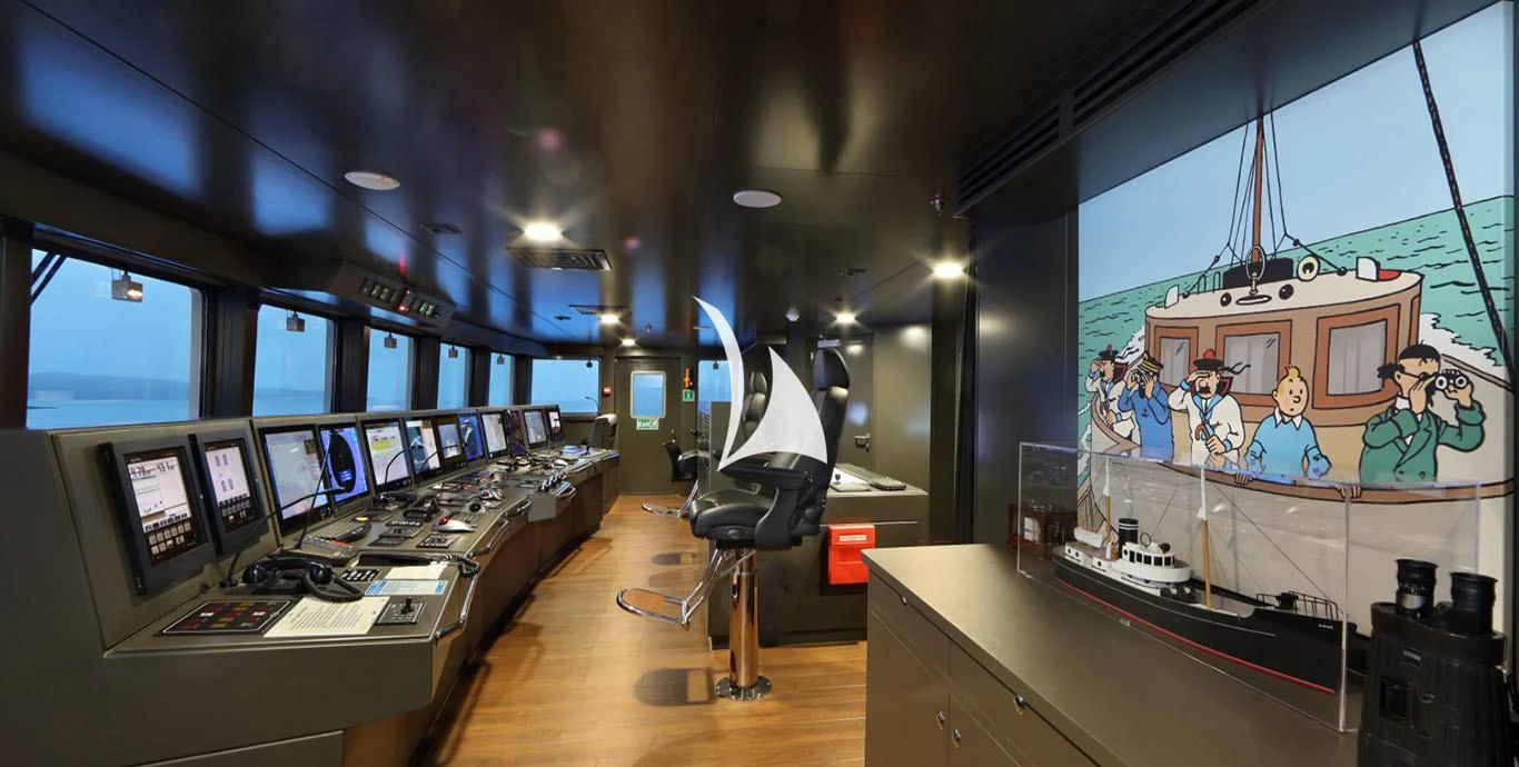 a room with many computers and screens aboard YERSIN Yacht for Charter