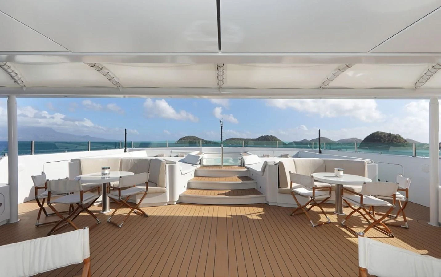 a room with tables and chairs aboard YERSIN Yacht for Charter
