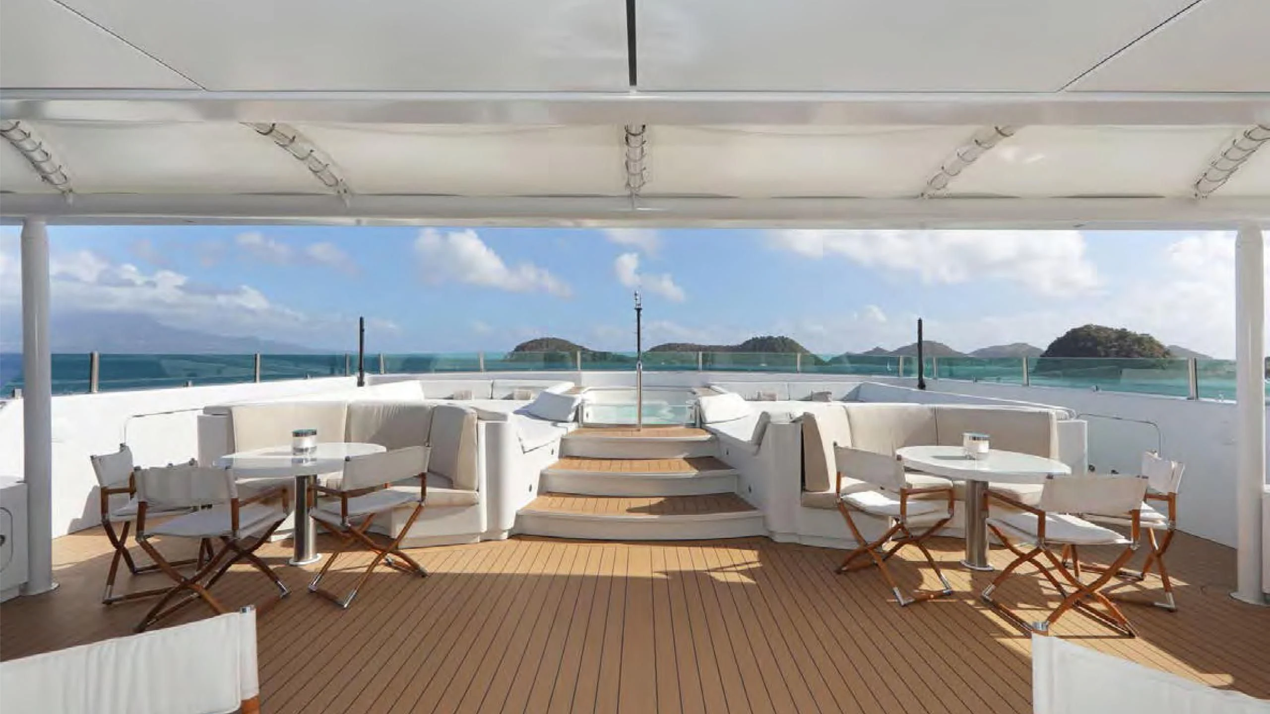 a room with tables and chairs aboard YERSIN Yacht for Charter