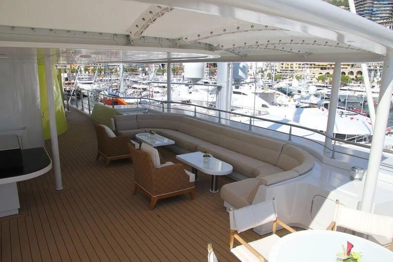 a room with a table chairs and a large window aboard YERSIN Yacht for Charter