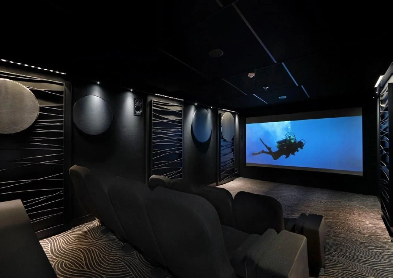 a room with a tv and couches aboard YERSIN Yacht for Charter