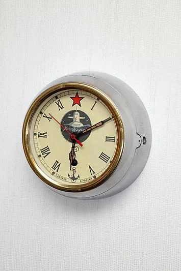 a clock on a wall aboard YERSIN Yacht for Charter