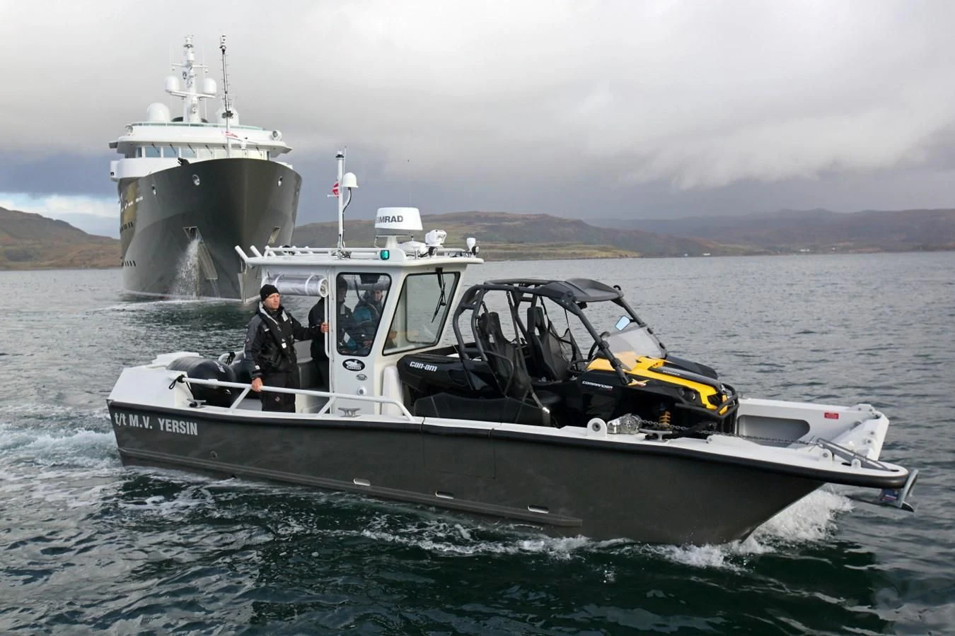 a boat with a helicopter on it aboard YERSIN Yacht for Charter