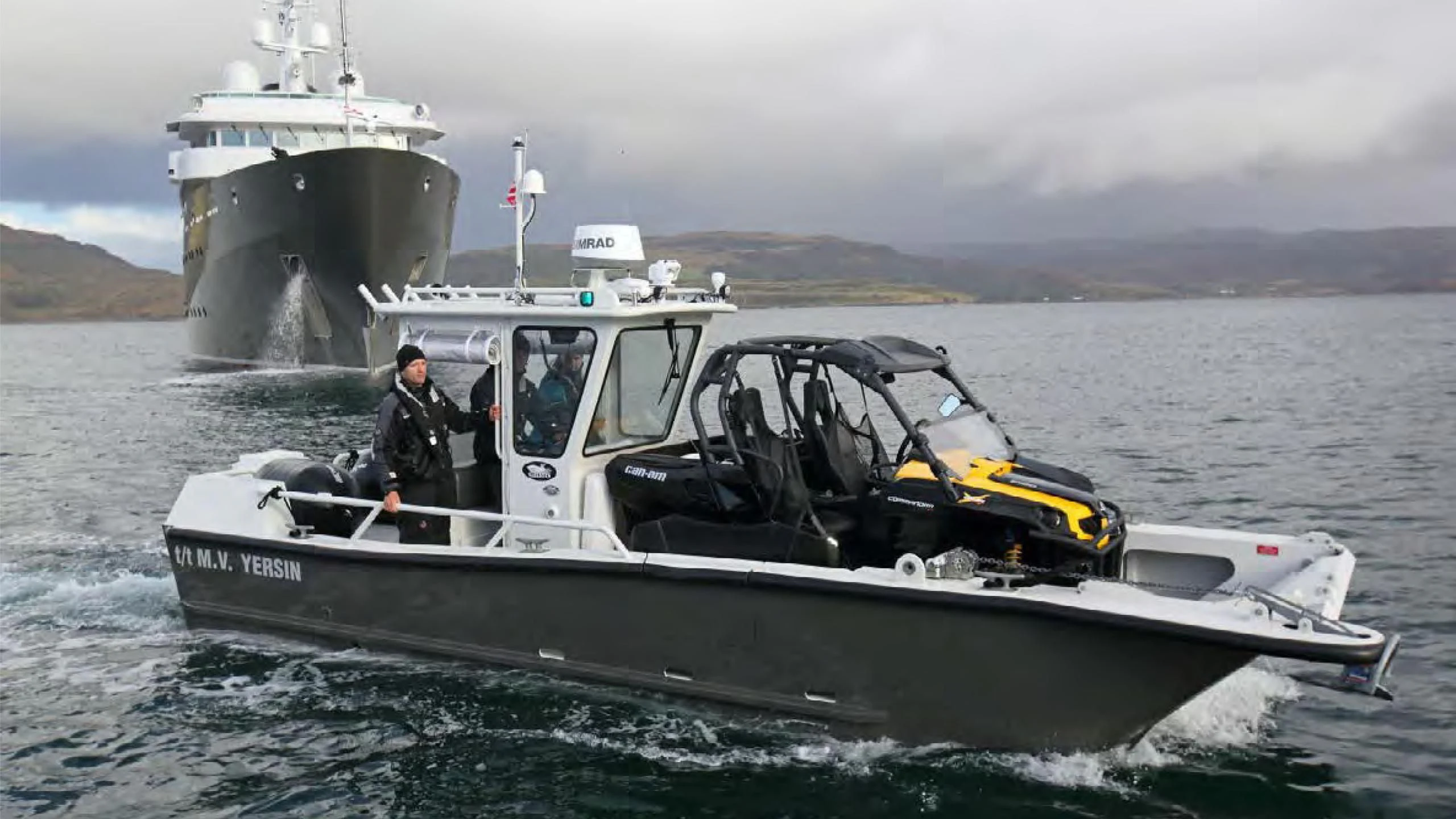 a boat with a large boat in the water aboard YERSIN Yacht for Charter