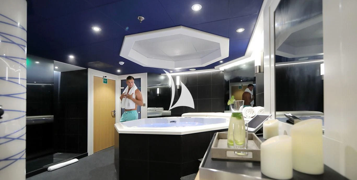 a person standing in a bathroom aboard YERSIN Yacht for Charter