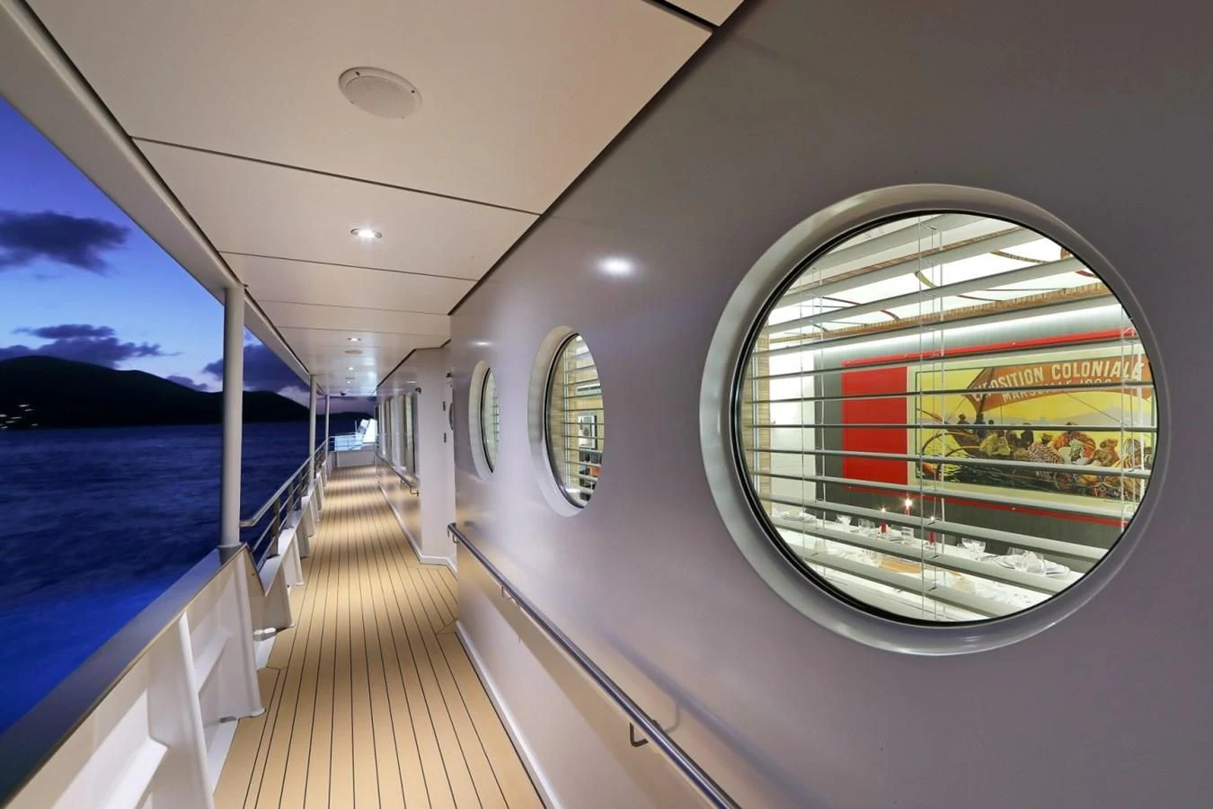 a train with a deck and a view of the water aboard YERSIN Yacht for Charter