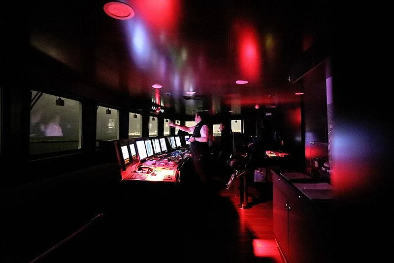 a person playing a guitar on a stage aboard YERSIN Yacht for Charter
