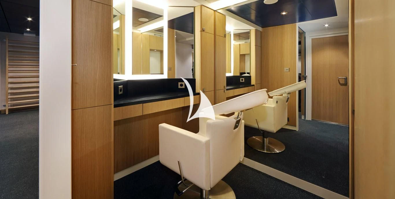a room with a chair and a desk aboard YERSIN Yacht for Charter