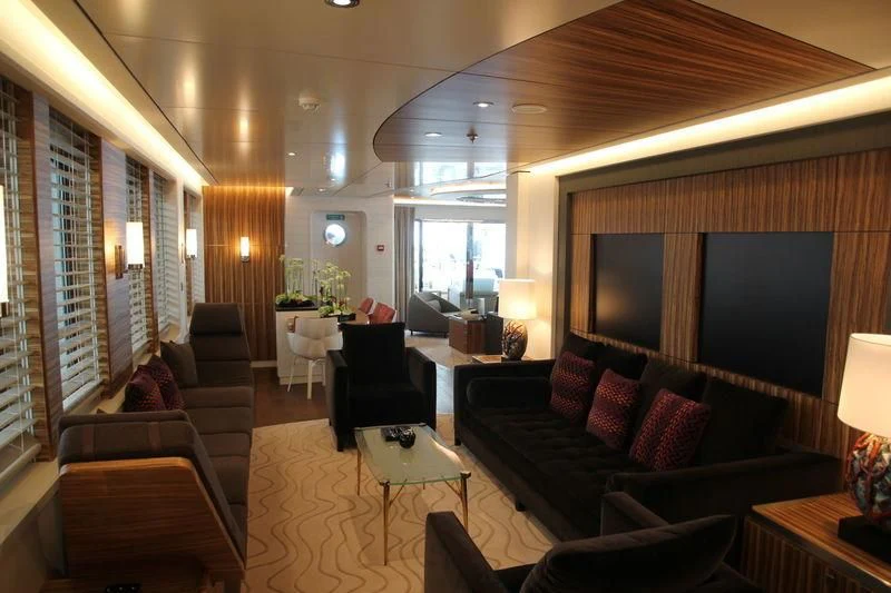 a living room with a large window aboard YERSIN Yacht for Charter