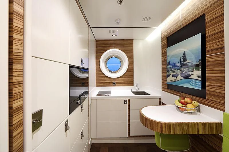 a bathroom with a round mirror aboard YERSIN Yacht for Charter