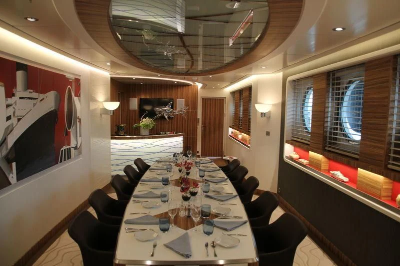 a dining room with a table and chairs aboard YERSIN Yacht for Charter