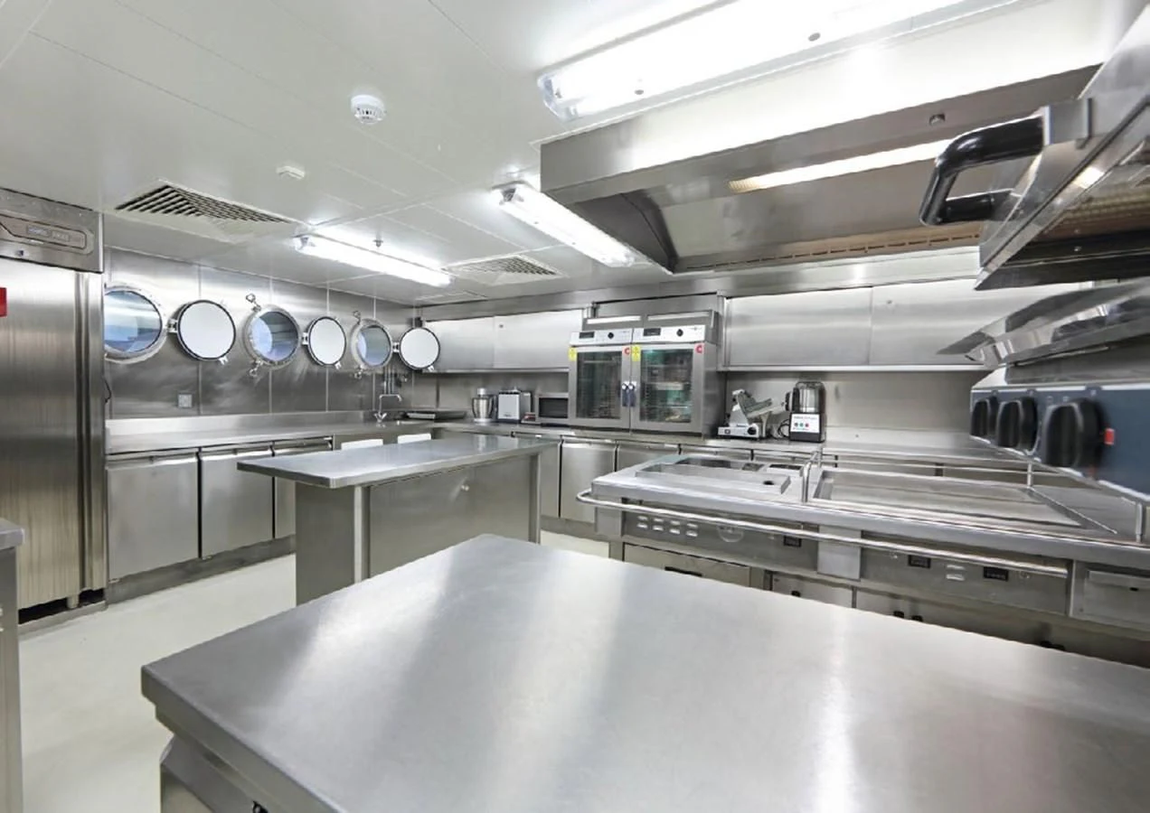 a large kitchen with stainless steel appliances aboard YERSIN Yacht for Charter