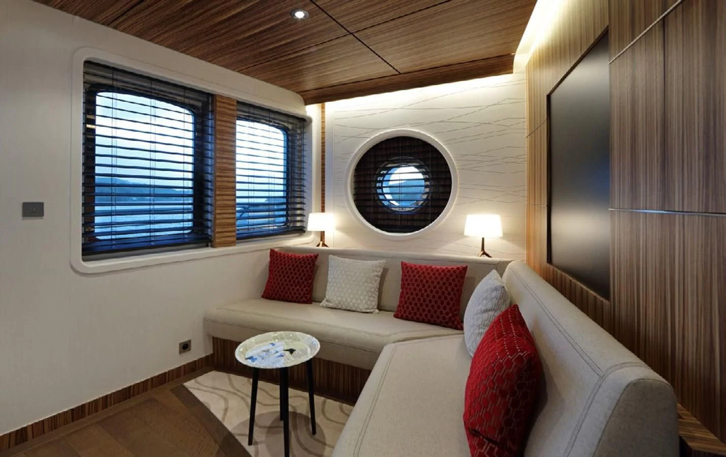 a living room with a couch and a window aboard YERSIN Yacht for Charter