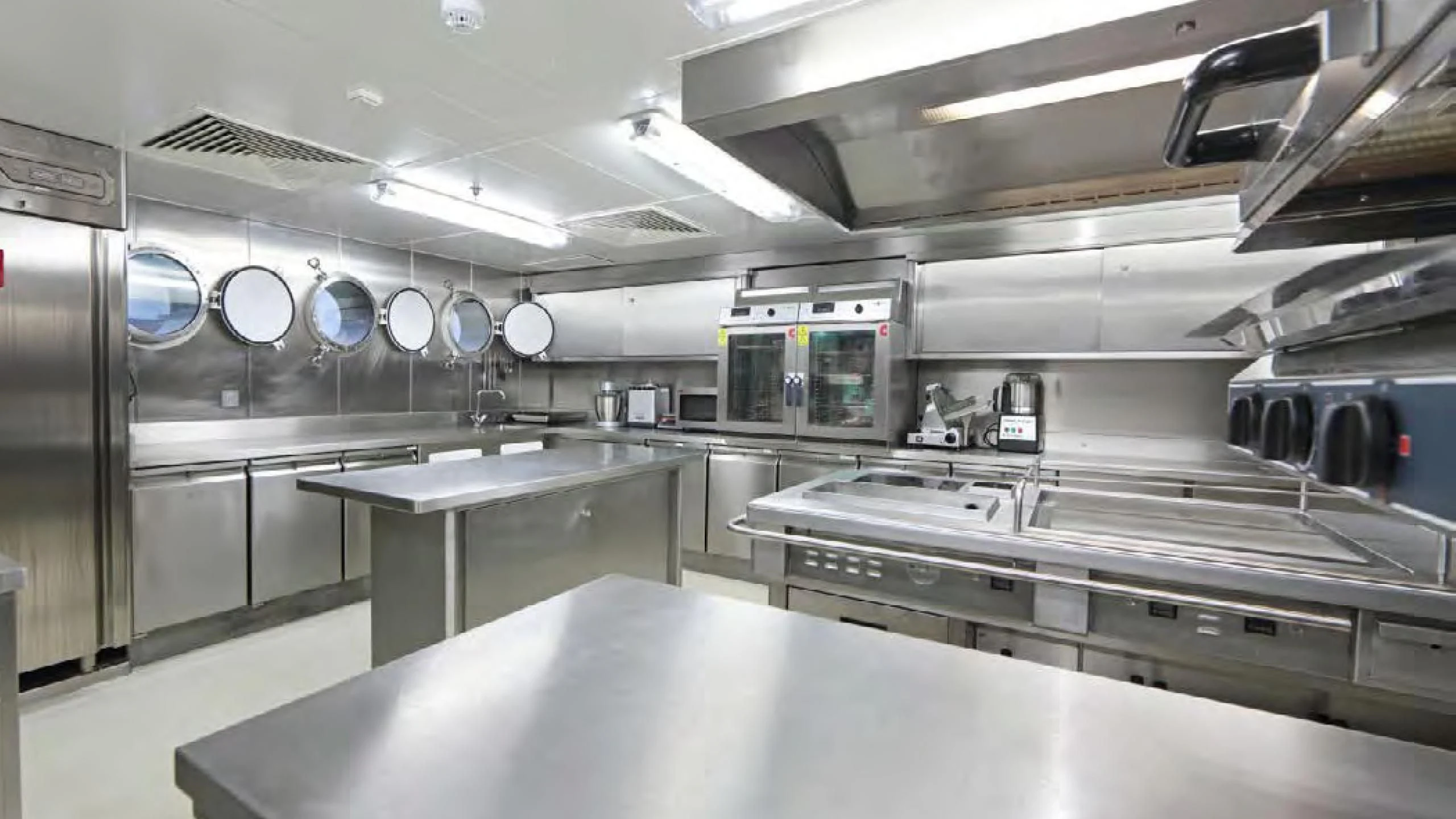 a large kitchen with stainless steel appliances aboard YERSIN Yacht for Charter