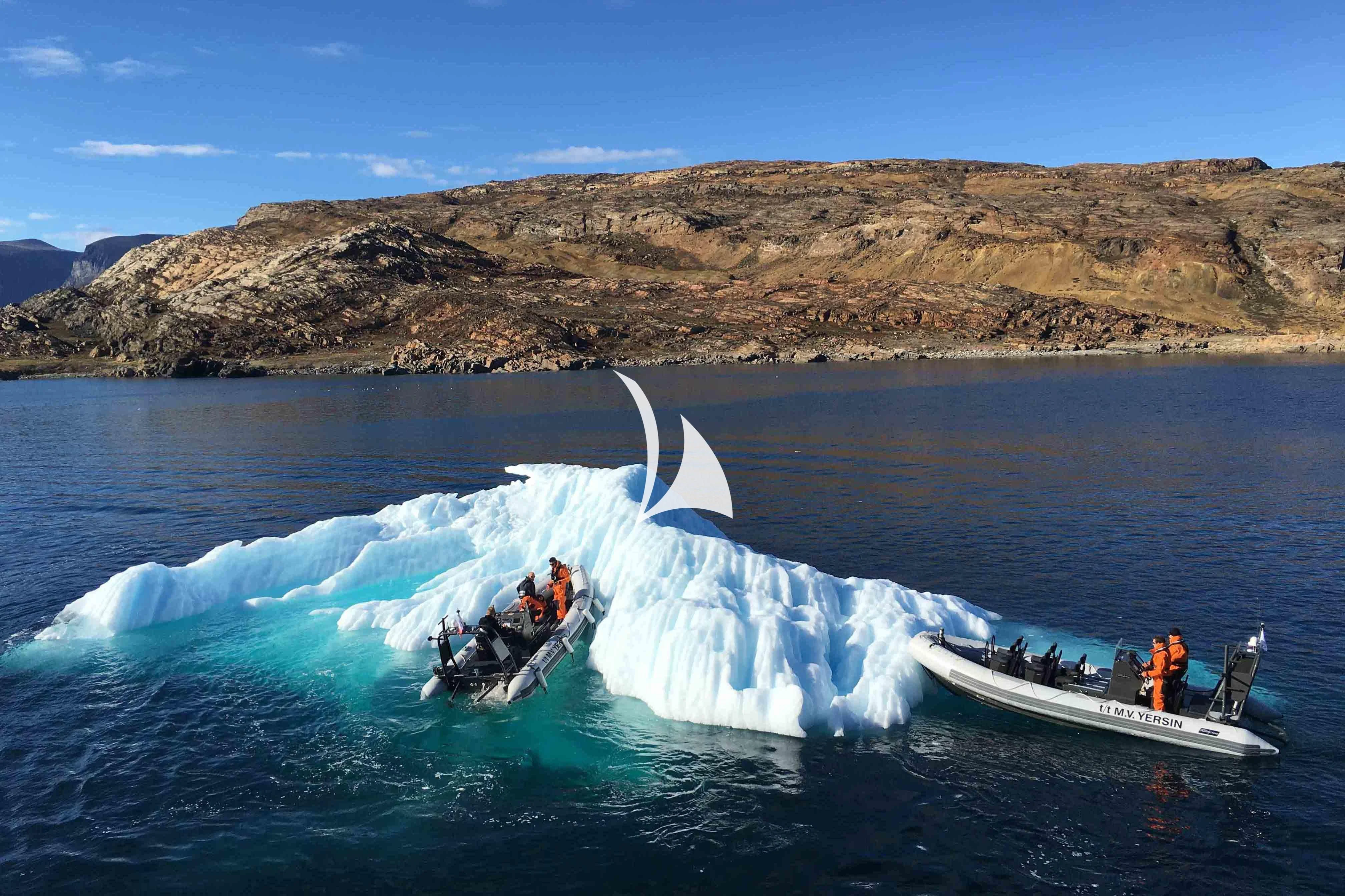 a boat with a group of people on it in the water aboard YERSIN Yacht for Charter