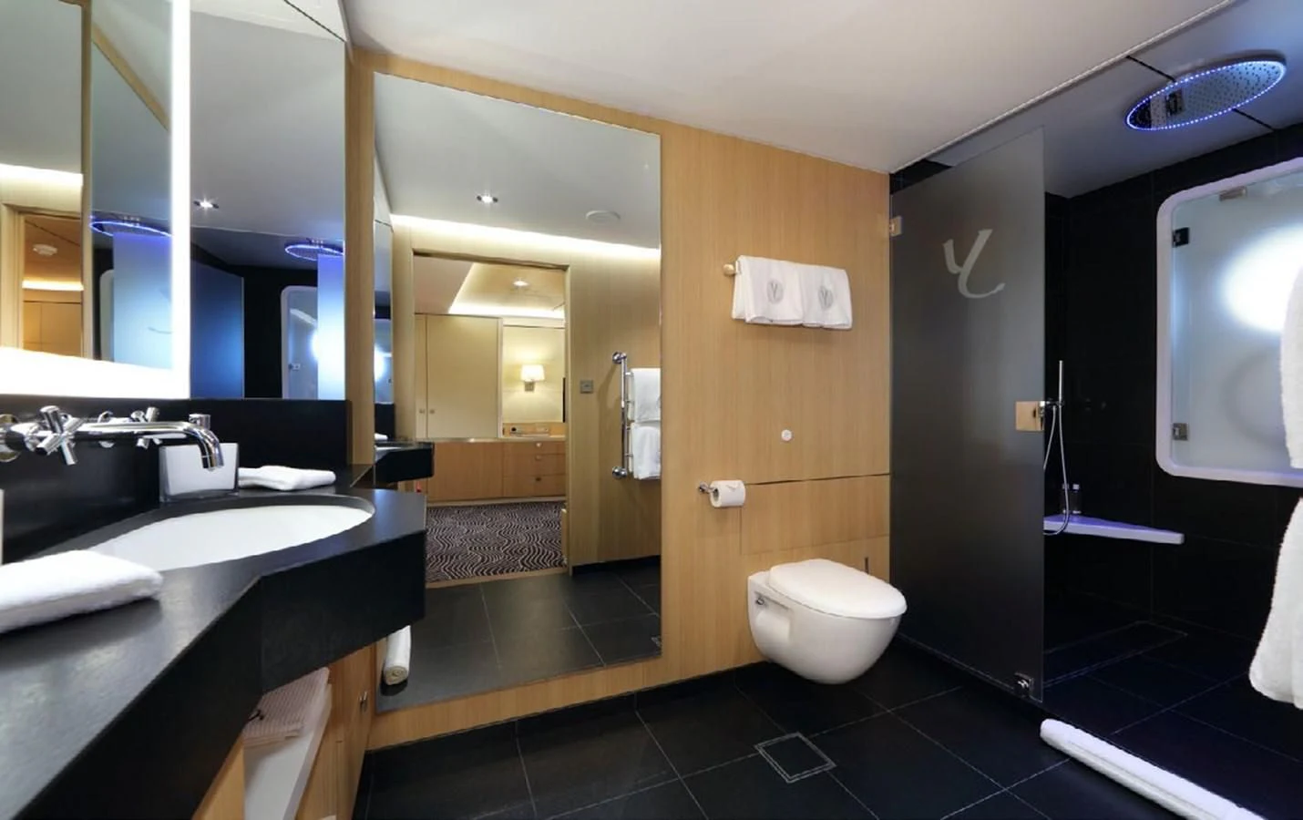 a bathroom with a large mirror aboard YERSIN Yacht for Charter