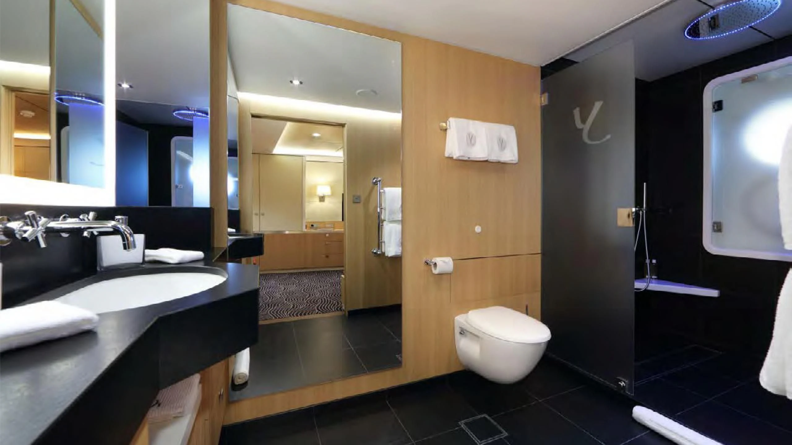 a bathroom with a large mirror aboard YERSIN Yacht for Charter