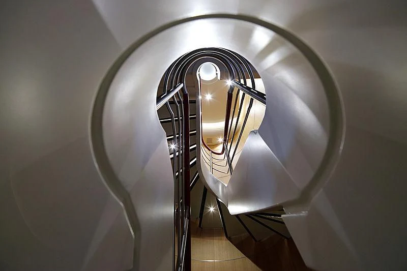a staircase with a light aboard YERSIN Yacht for Charter
