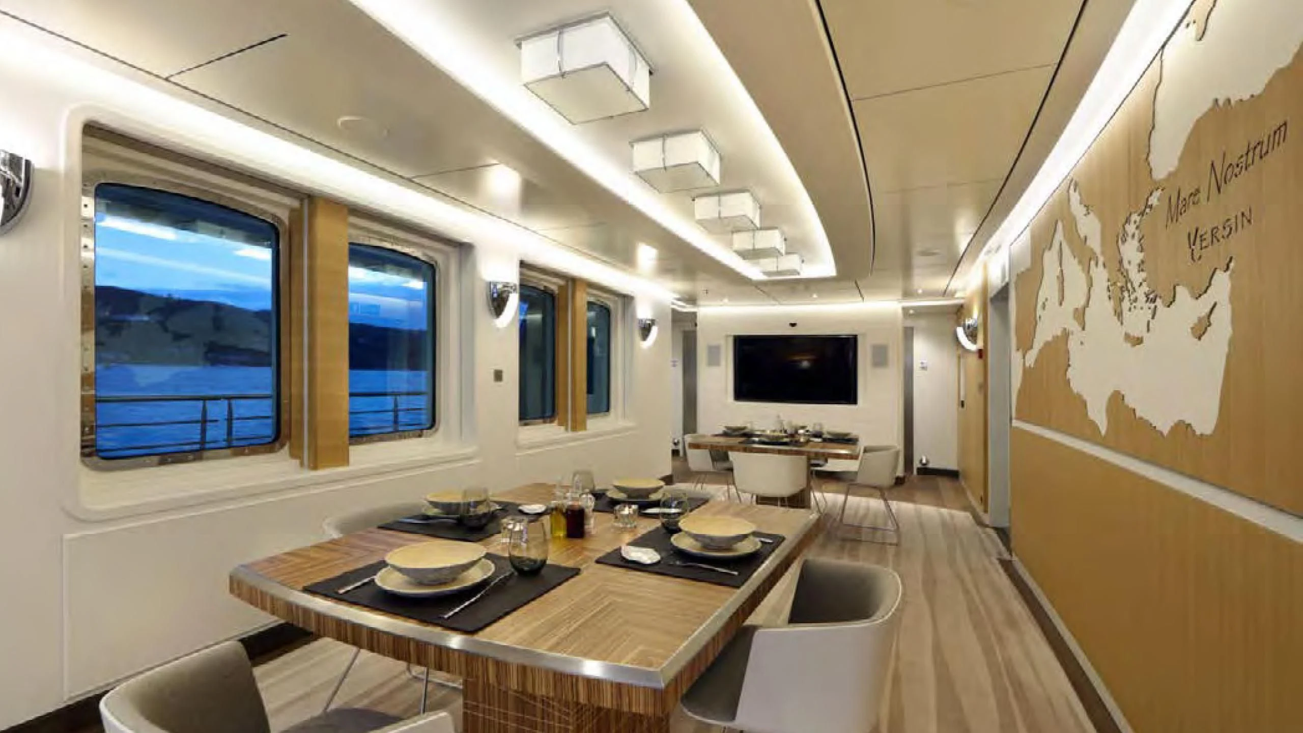 a kitchen with a table and chairs aboard YERSIN Yacht for Charter