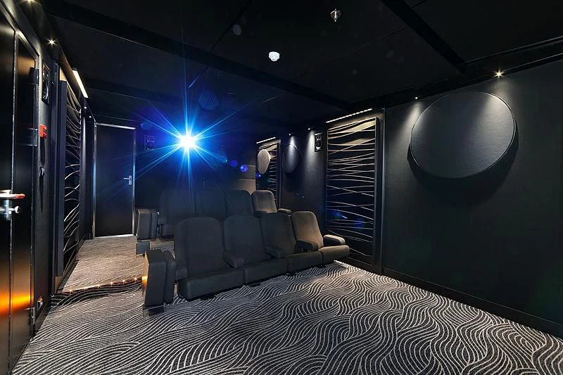 a room with a couch and a large mirror aboard YERSIN Yacht for Charter