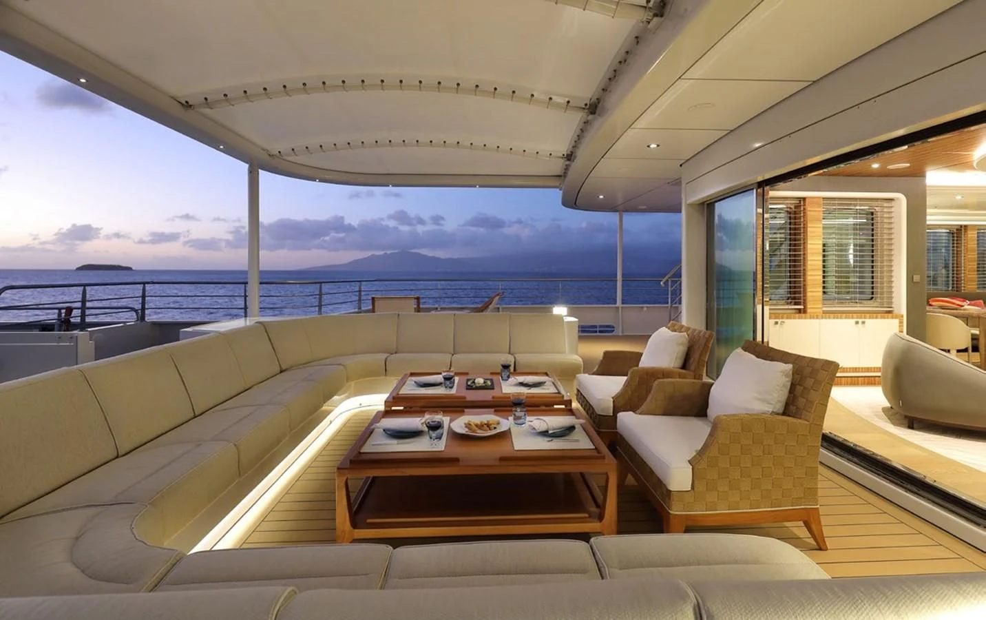 a living room with a large balcony aboard YERSIN Yacht for Charter