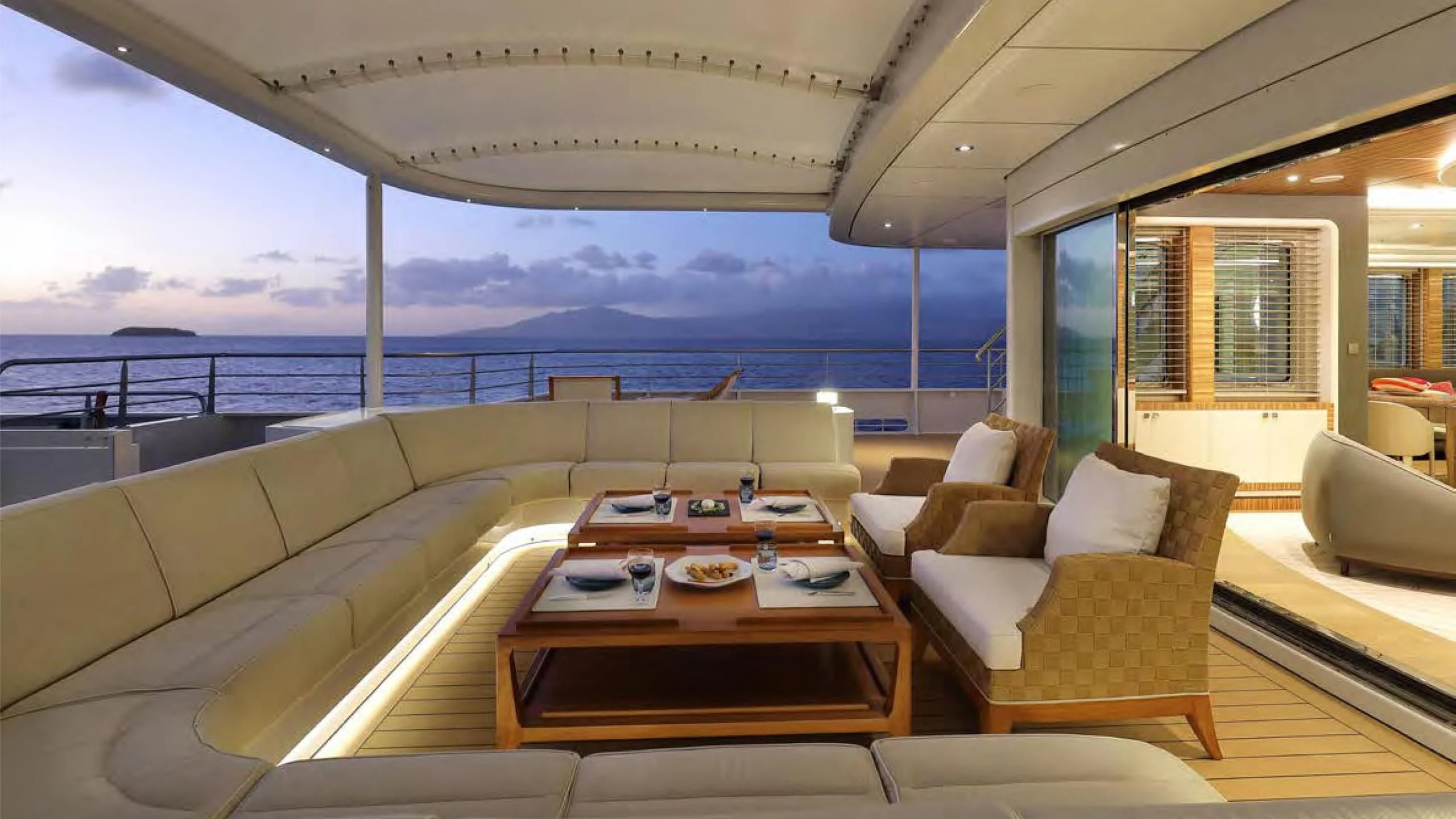 a living room with a large balcony aboard YERSIN Yacht for Charter
