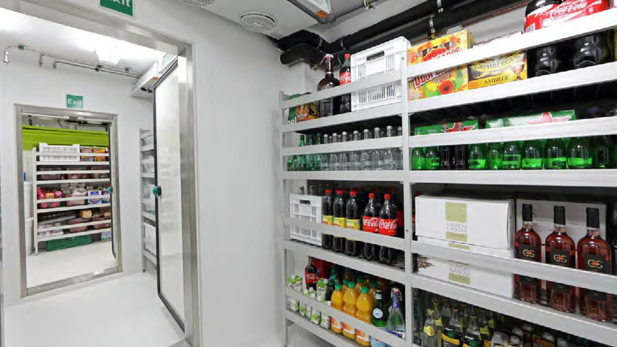 a fridge with bottles of alcohol aboard YERSIN Yacht for Charter
