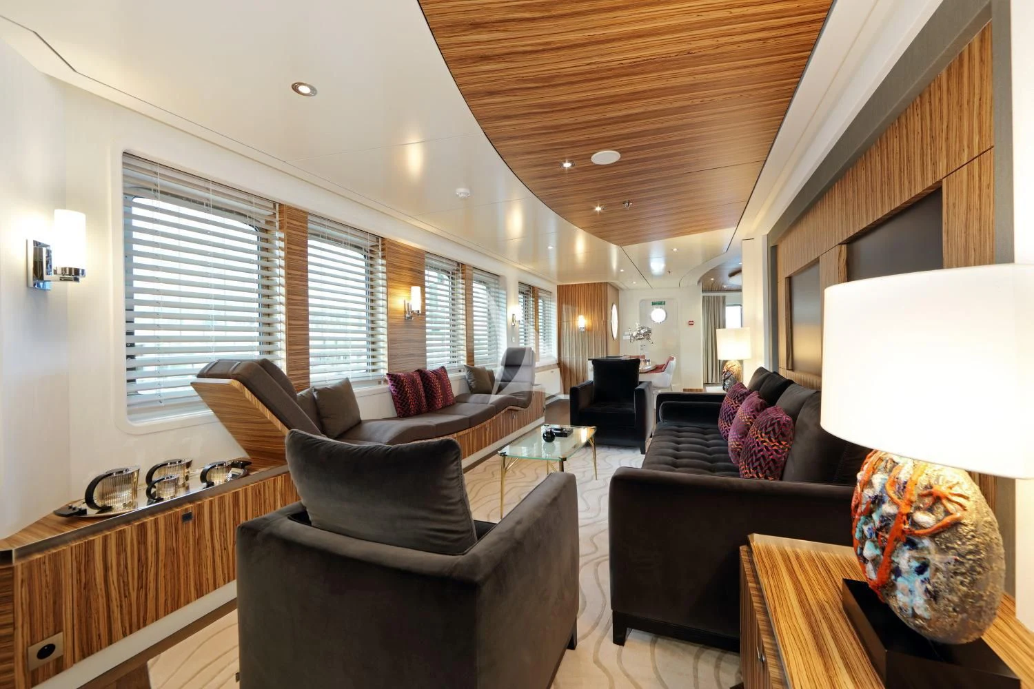 a living room with a large window aboard YERSIN Yacht for Charter