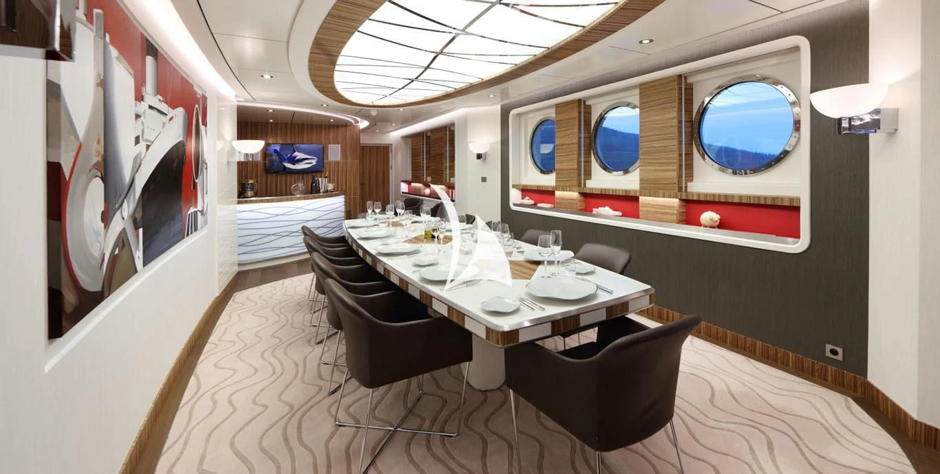 a room with a table and chairs aboard YERSIN Yacht for Charter