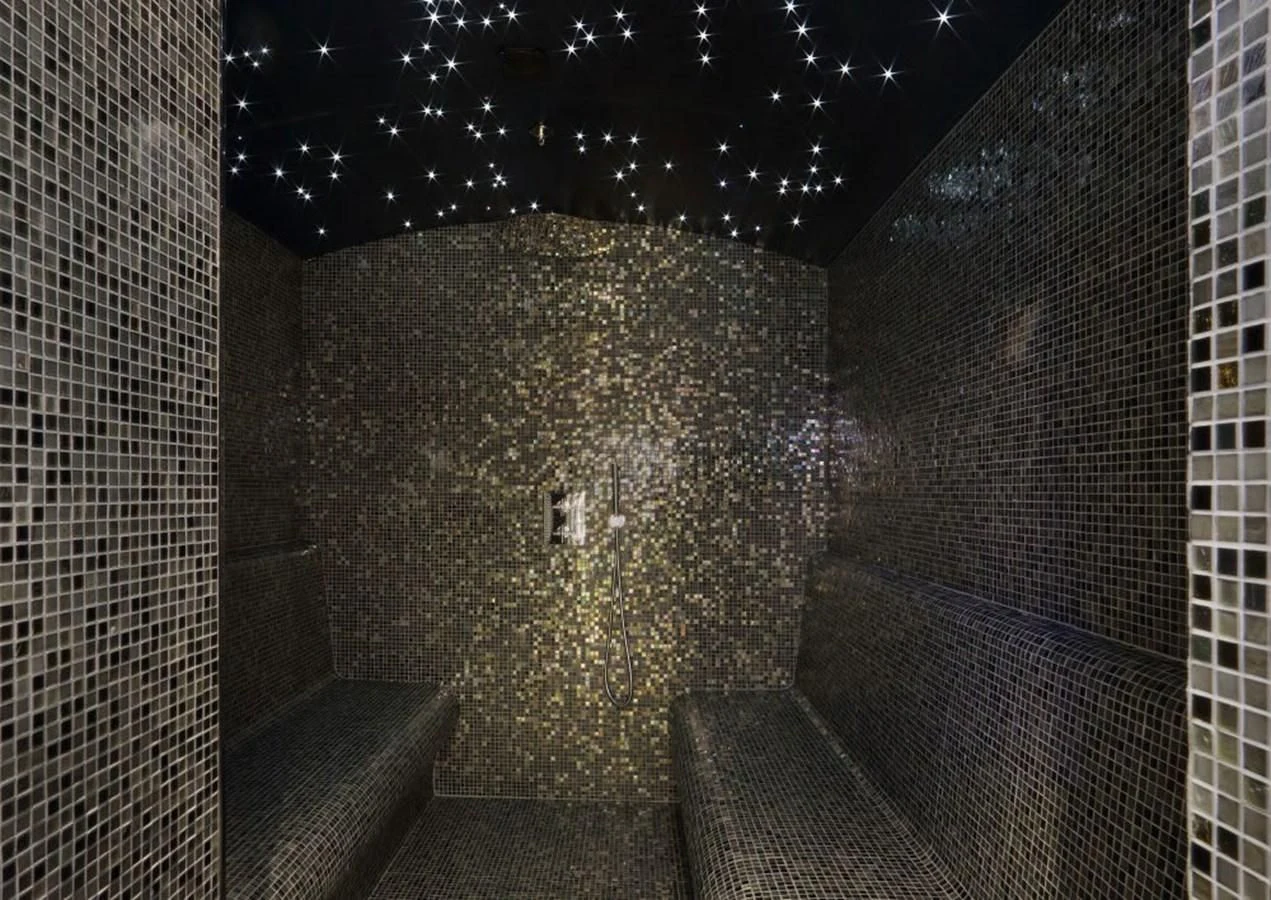 a stone tunnel with a light on it aboard YERSIN Yacht for Charter