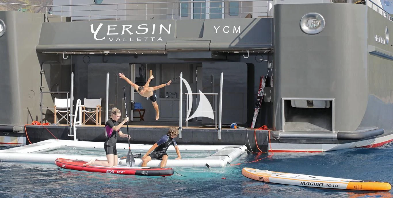 a group of people on surfboards aboard YERSIN Yacht for Charter